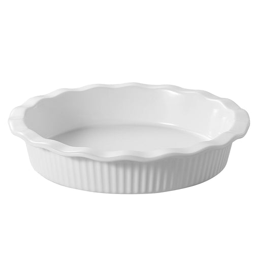 White ceramic pie dish with scalloped edge on a white background