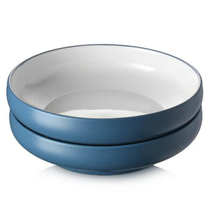 Two blue ceramic bowls stacked on a white background