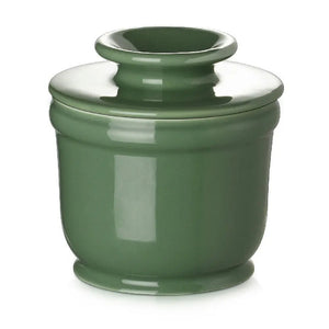 Green ceramic jar with a lid on a white background