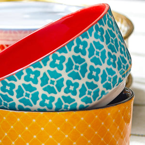 Stack of colorful ceramic bowls with geometric patterns