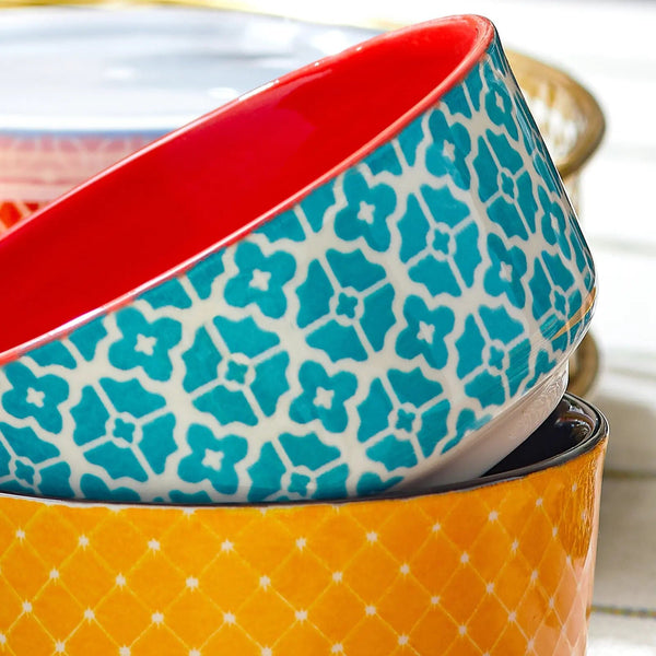 Stack of colorful ceramic bowls with geometric patterns