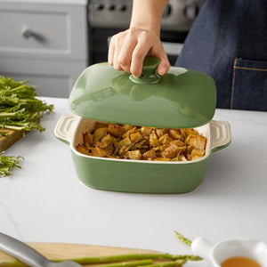 Green baking dish with food on a kitchen counter